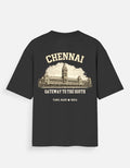 A black short-sleeve t-shirt with a vintage-style cream graphic on the back featuring the word 'CHENNAI', an illustration of the Chennai Railway Station, and the text 'GATEWAY TO THE SOUTH' and 'TAMIL NADU • INDIA'.