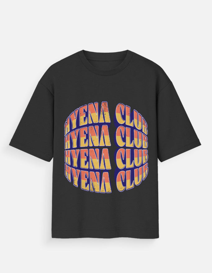 A black short-sleeve t-shirt with a large graphic print on the front. The graphic features the word 'HYENA' repeated vertically in a wavy, 3D-effect font with a yellow-to-orange gradient and a dark blue outline, forming an oval shape.