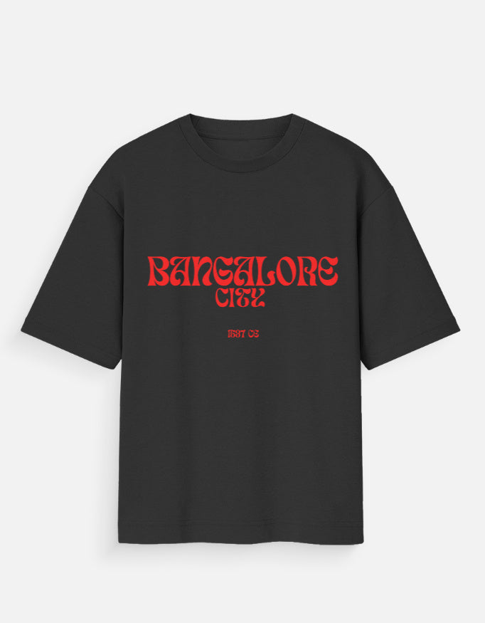 Navy blue t-shirt with red and white graphic design on a light gray background