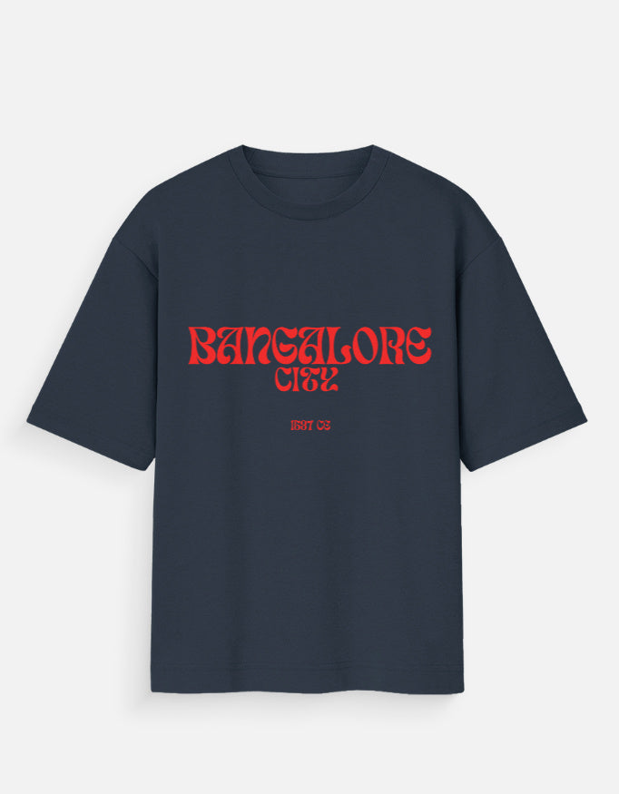 Navy blue t-shirt with red and white graphic design on a light gray background