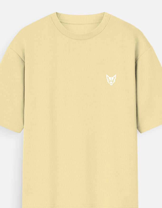 A pale yellow short-sleeve crewneck t-shirt with a small white stylized logo on the left chest, displayed against a light gray background.